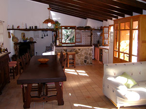 The large living/dining room with the American kitchen in the background.